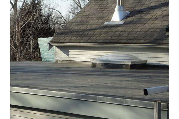 Flat EPDM roof and re-flashed skylight